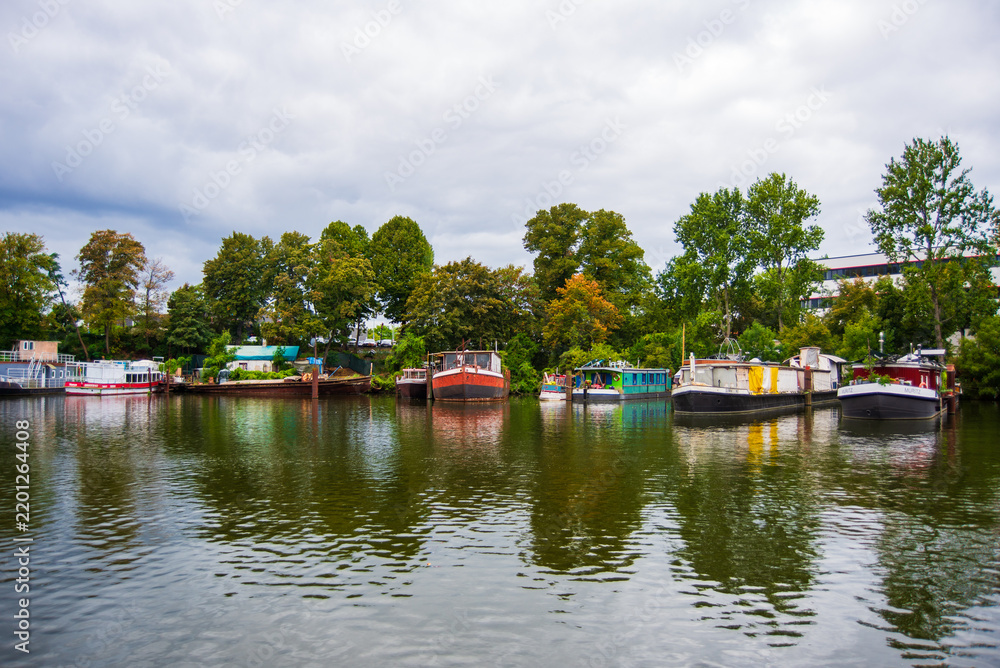 Fototapeta premium House boats moored on a side arm of the Havel river