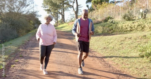 Lifestyle videos outdoor of people doing activities, jogging on dirt path, senior couple enjoying ou