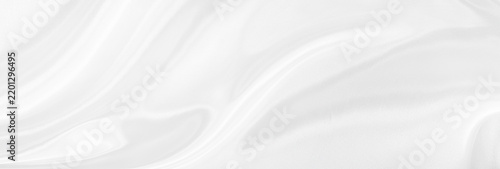 White gray satin texture that is white silver fabric silk panorama background with beautiful soft blur pattern natural.
