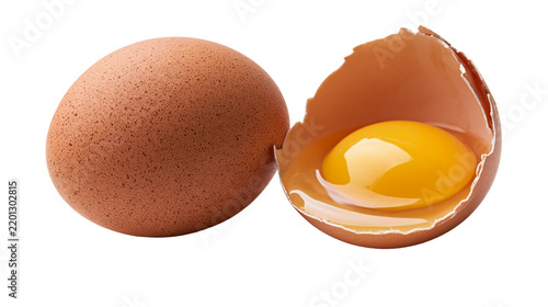 Canvastavla Whole brown chicken egg next to a cracked eggshell with a bright yellow yolk