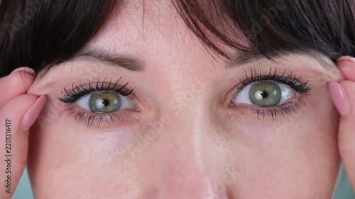 The woman has a drooping eyelid
