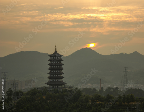 Cultural heritage and travel, ancient pagoda silhouette at sunset in rural landscape