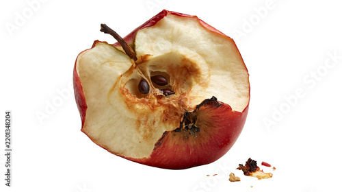 Фотография Bitten red apple core with visible seeds and brown oxidized flesh