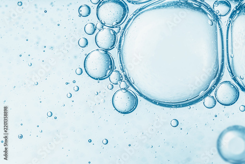 Abstract light blue water bubbles macro texture background for cosmetic serum