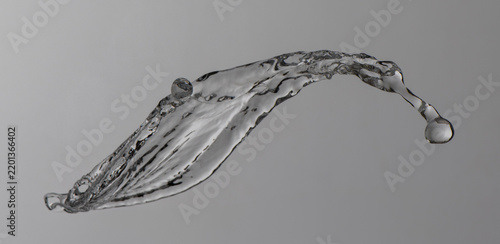 clear water splashes on grey background