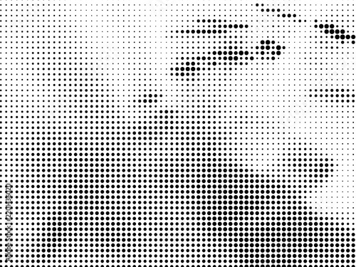 Abstract halftone pattern background with black dots of varying sizes on a white background