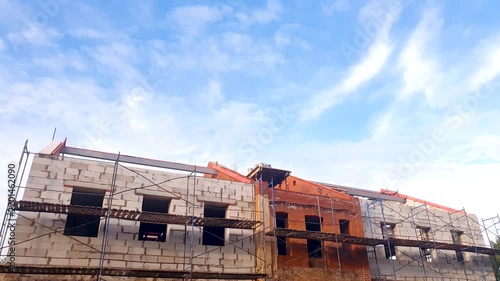 Renovation and restoration of the exterior appearance of buildings using scaffolding. Improvement of the exterior appearance of a city building