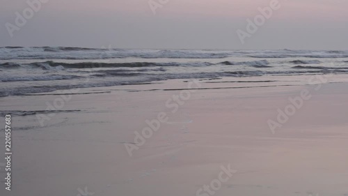 Serene Sunset at Parangtritis Beach, Yogyakarta - Gentle Waves Lapping on Sandy Shoreline