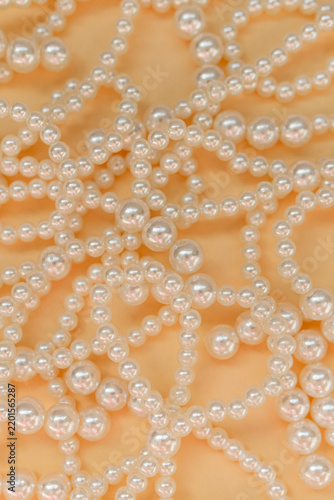 Elegant Pearl Beads Texture on Golden Background, Luxury Jewelry Concept, top view