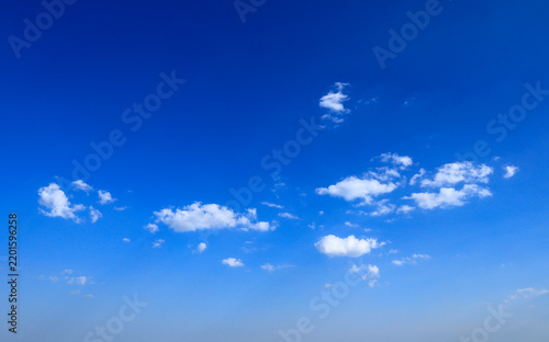 Blue sky with soft white clouds on clear day