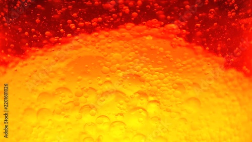 Abstract Red and Yellow Lava Lamp Bubbles Floating in Liquid, Psychedelic Retro Background with Glowing Gradient
