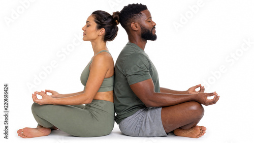 Diverse couple sitting back to back in yoga meditation poses