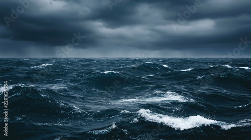 Stormy ocean waves under dark cloudy sky, dramatic seascape background