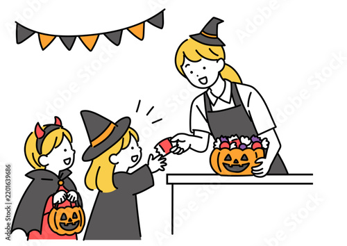 Tapety artystyczne ハロウィンに子どもにお菓子を渡すスタッフ