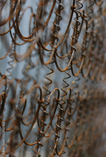 An old metal structure with traces of rust and a pronounced texture, shown in close‑up	
