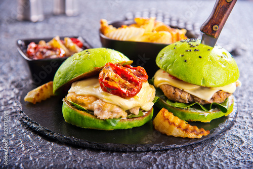 Fotografie Close-up home made burger on dark table