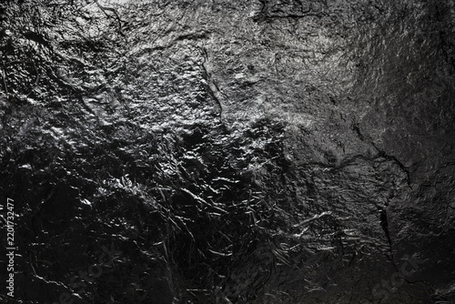 Black metal background or texture. Dark metal surface.