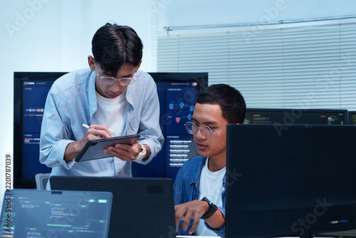 Programmers Collaborating on Software Development and AI Technology
