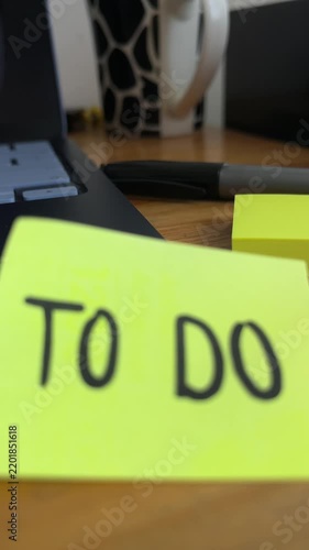 To do list sticky note on desk with laptop and pen