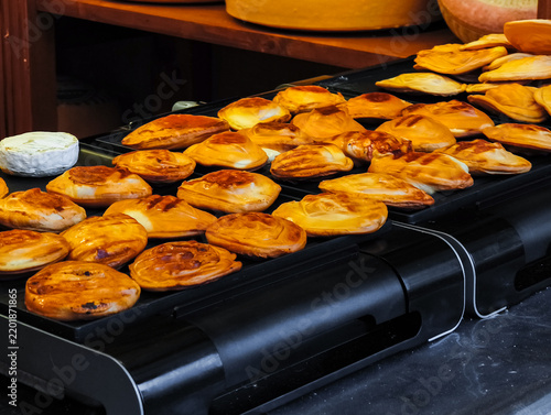 Photography Grilled smoked cheese preparing at prague christmas market