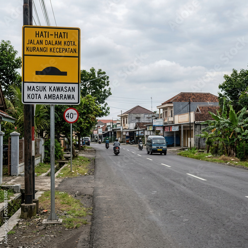 Cautionary Traffic Signage In An Urban Southeast Asian Street Scene