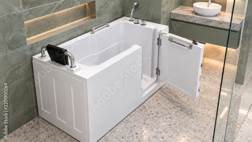 Accessible walk in bathtub with door, seat, grab bars and shower for disabled seniors in modern bathroom, mobility safety.