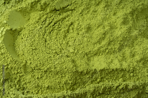 Matcha tea, matcha powder as a background.