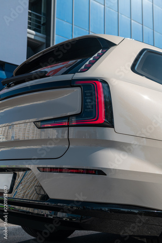 Close up rear view of a modern luxury suv featuring distinctive red led tail light design details