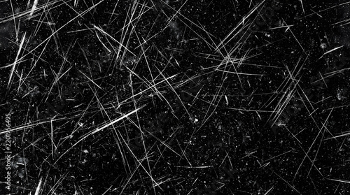 Grungy black texture with white scratches, distressed vintage film overlay, dark weathered surface with heavy scuff marks and dust particles