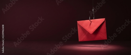 Phishing Email Trap Concept with Red Envelope Caught on Fishing Hook.