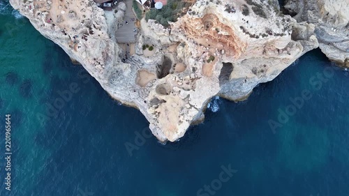 Aerial top-down view revealing algar seco cliffs and restaurant