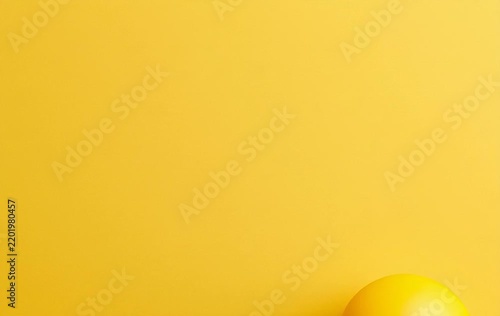 Minimalist Yellow Light Bulb on Bright Yellow Surface Representing Creative Idea Concept