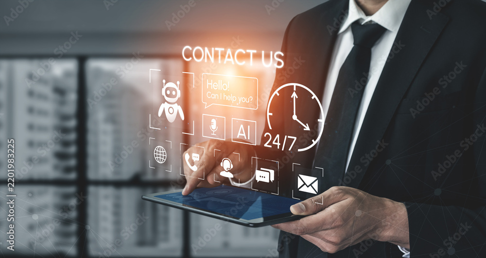 Obraz premium Business Professional Using Tablet with Digital Contact Us Interface and Virtual Assistant Technology in Modern Office Setting. Entropy.
