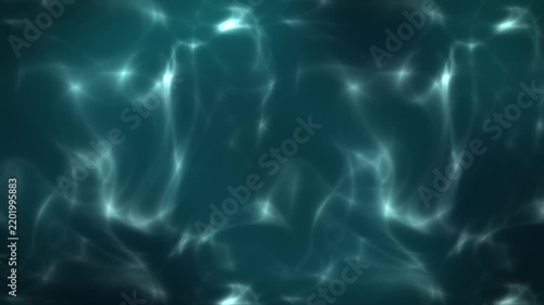 Abstract underwater light patterns on a deep blue green ocean surface with shimmering reflections and ripples