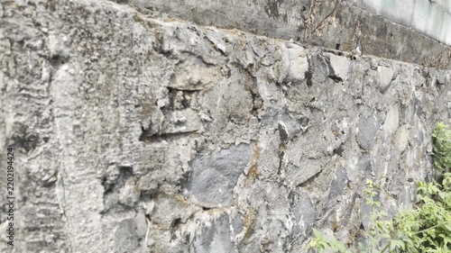 Rough Weathered Stone Wall with Moss and Lichen