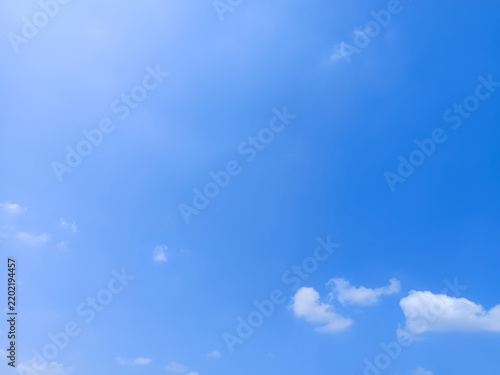 Cumulus clouds in the sky are abstract and aesthetic, with a blue sky background. Cumulus clouds are white clouds that have a flat base so they look very soft and fluffy