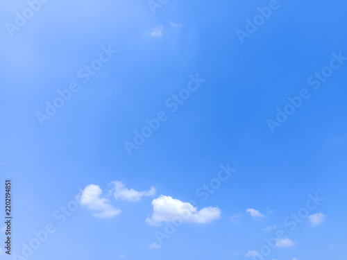 Cumulus clouds in the sky are abstract and aesthetic, with a blue sky background. Cumulus clouds are white clouds that have a flat base so they look very soft and fluffy