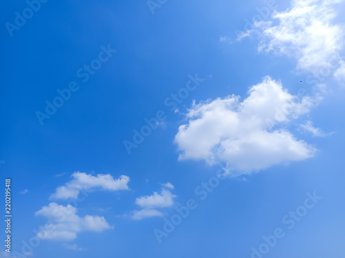 Cumulus clouds in the sky are abstract and aesthetic, with a blue sky background. Cumulus clouds are white clouds that have a flat base so they look very soft and fluffy