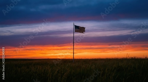 American Flag on Pole in Grassy Field Against Colorful Sunset Sky