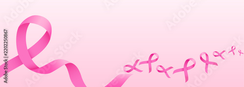 Breast cancer awareness banner background with pink ribbon.
