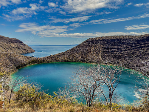 Isabela Island in the Galápagos Archipelago. Darwin Lake, a saltwater crater lake inside a tuff cone, and Tagus Cove in the background
