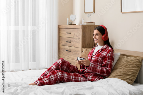 Gaming hobby and leisure time, young woman playing video games with controlle...