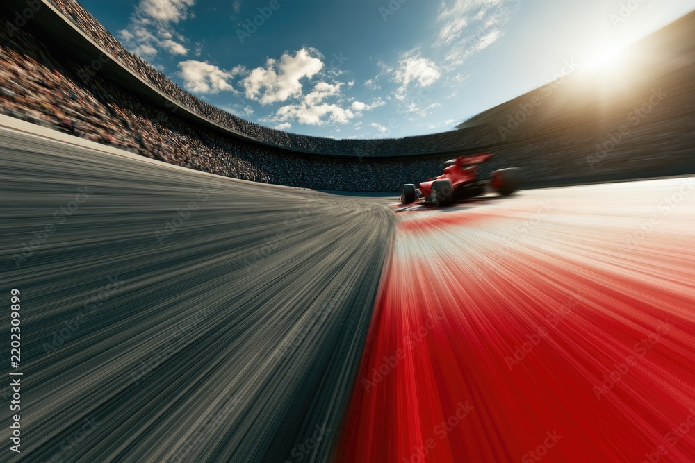 Obraz premium A dynamic shot of a red Formula 1 race car speeding on a curved track inside a large stadium under a partly cloudy sky.