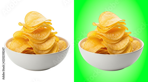 Crispy potato chips piled in white bowl on background