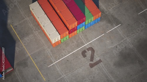 Cargo storage yard, top view of multi-colored shipping containers in shipping yard. 3d animation.