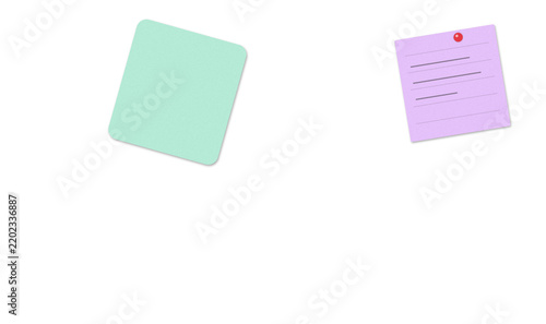 Light green sticky note and purple notepad with red pin on white background for office organization