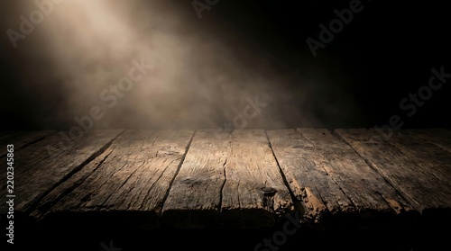 Empty rustic wooden table in a dark room with spotlight