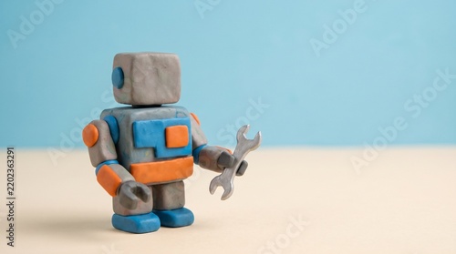 3D Clay Robot Holding Wrench Representing AI and Industrial Automation