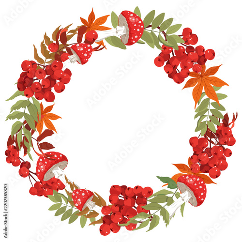 Autumn wreath with rowan berries, maple leaves and fly agaric mushrooms on white background.