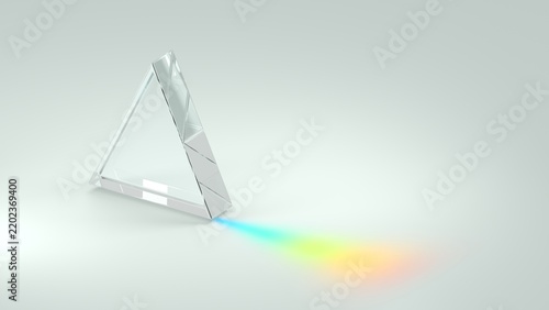 Clear glass prism reflects rainbow spectrum